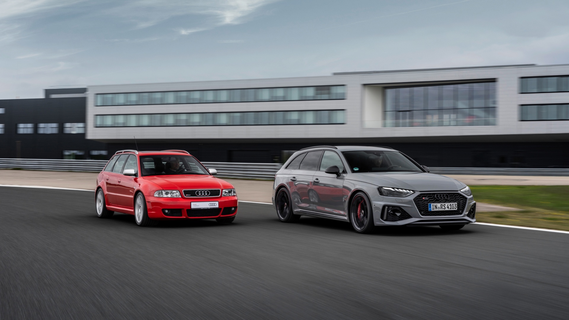 An Audi RS 4 (B5) and a current Audi RS model driving on a racetrack.